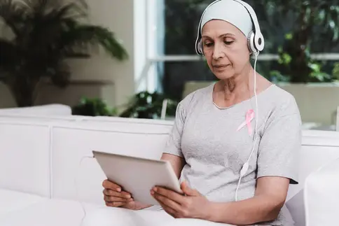 photo of woman using tablet