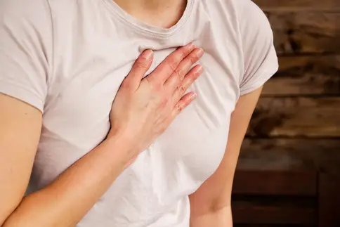 photo of woman experiencing chest pain